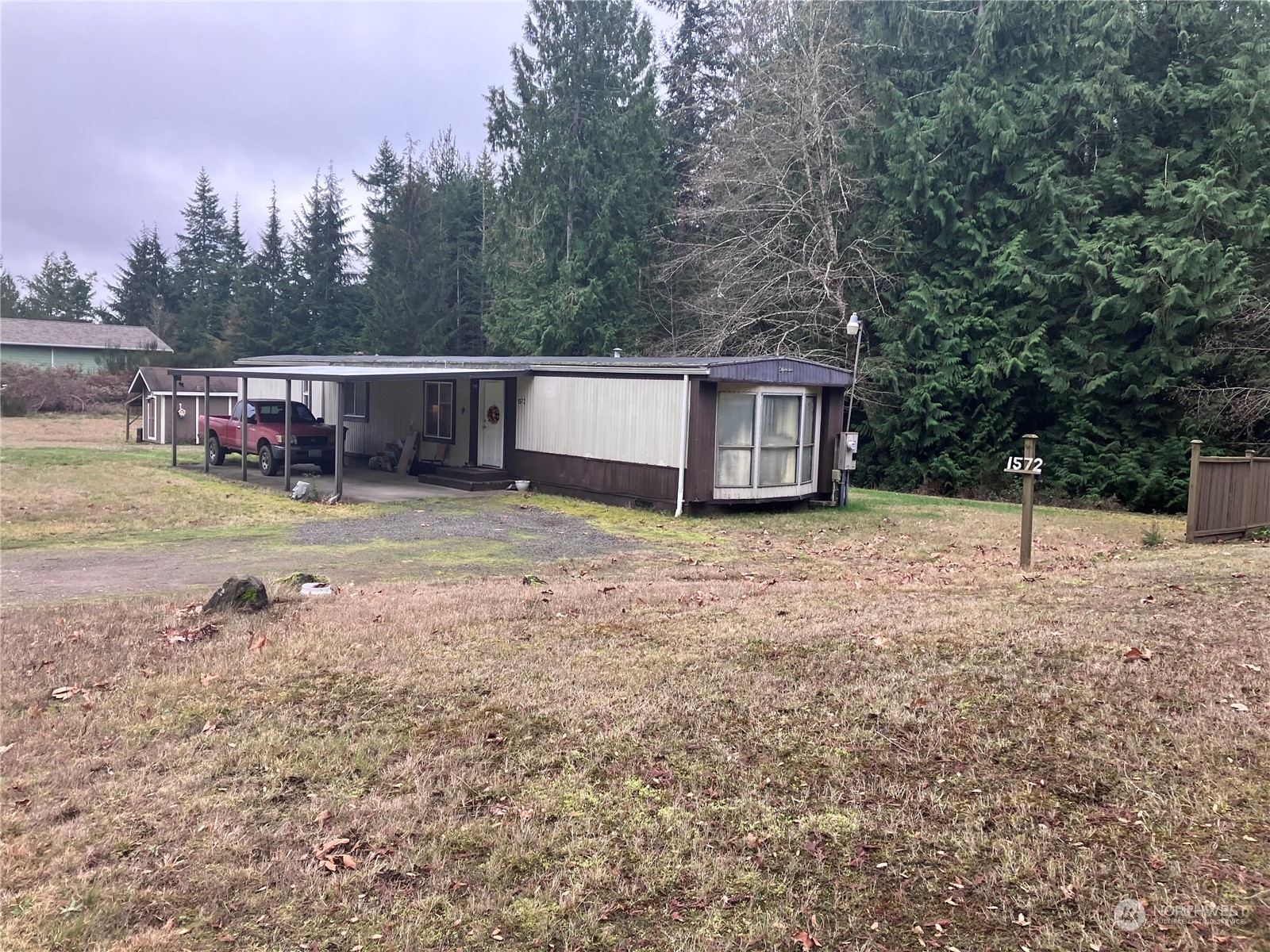 1566 Southwest Old Clifton Road Port Orchard, WA 98367 - Photo 6 of 11 a backyard of a house with barbeque oven