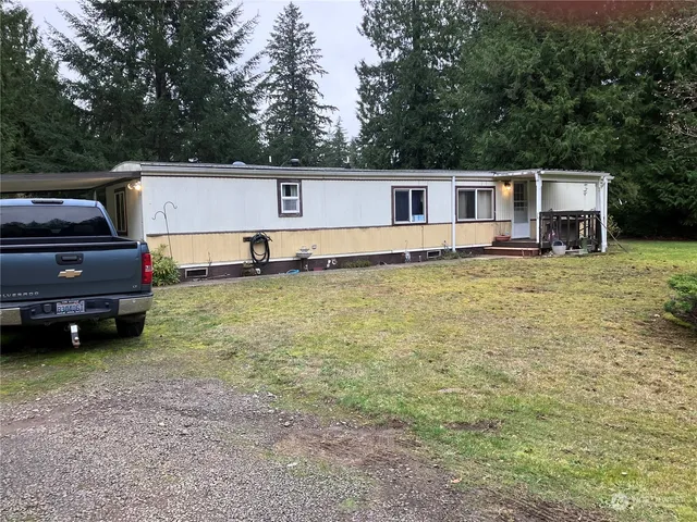 a view of a house with a back yard