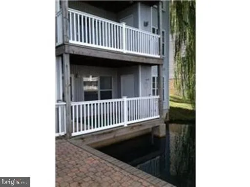 a view of a balcony with wooden floor