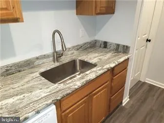 a view of a kitchen with a sink and dishwasher