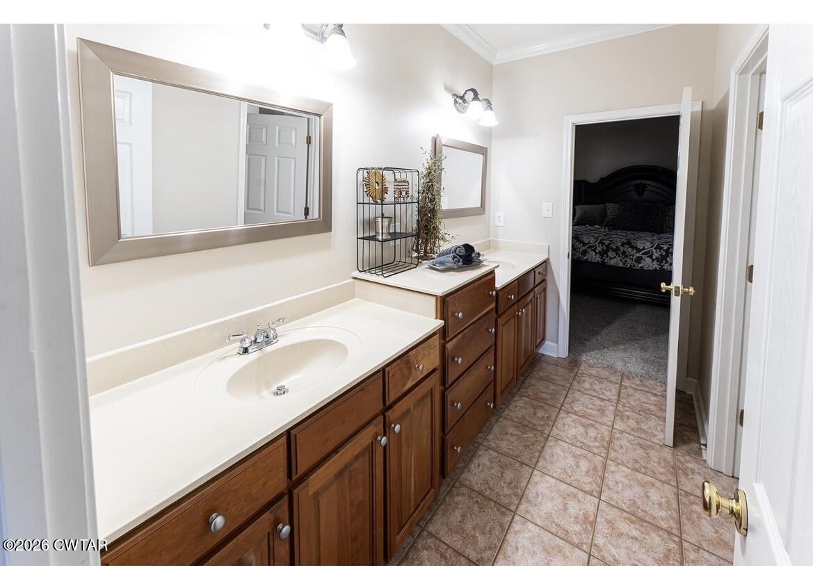 9 Shadow Ridge Drive Jackson, TN 38305 - Photo 14 of 25 a bathroom with a double vanity sink and mirror