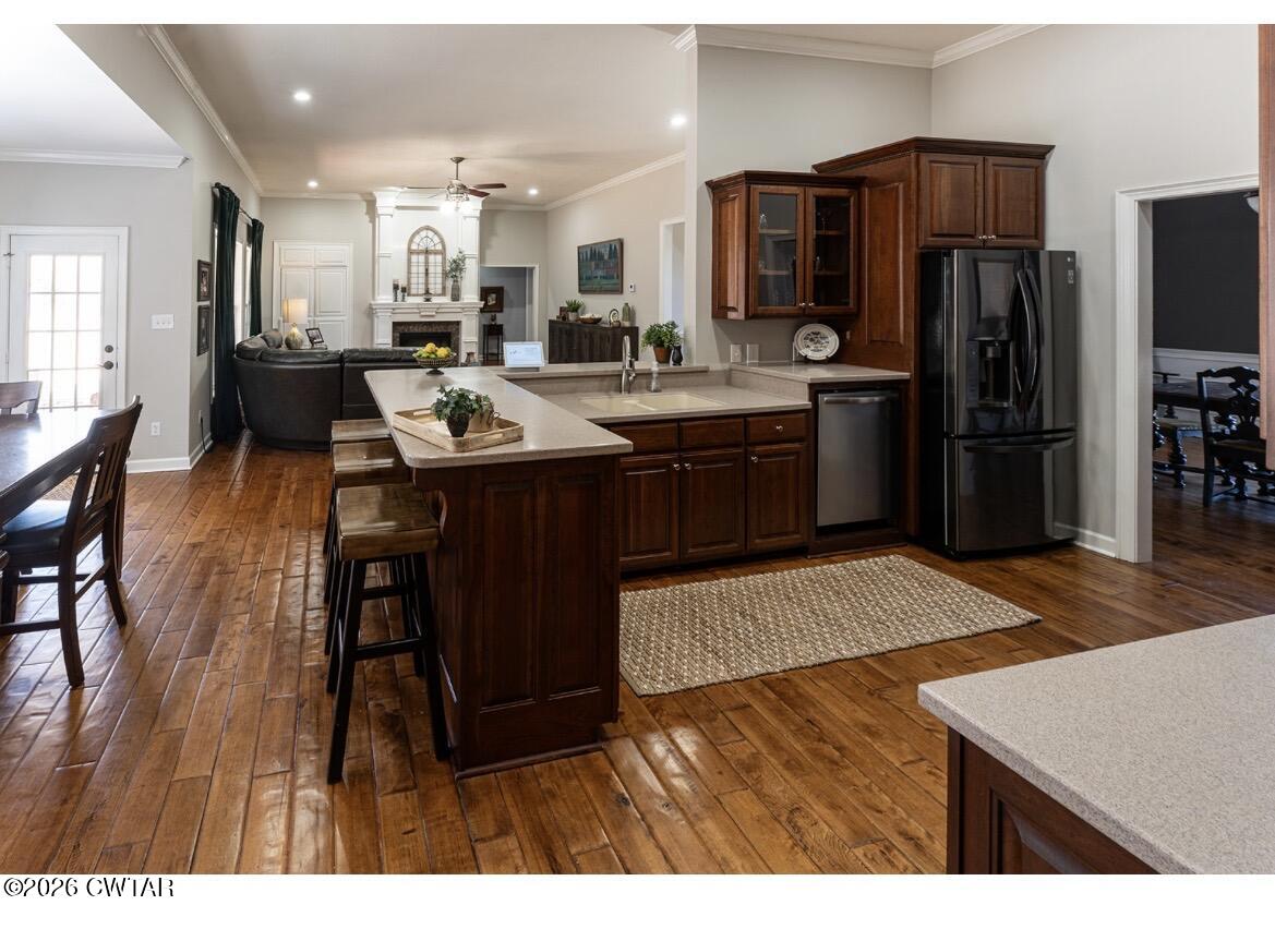 9 Shadow Ridge Drive Jackson, TN 38305 - Photo 20 of 25 a kitchen with stainless steel appliances kitchen island granite countertop a sink refrigerator and cabinets