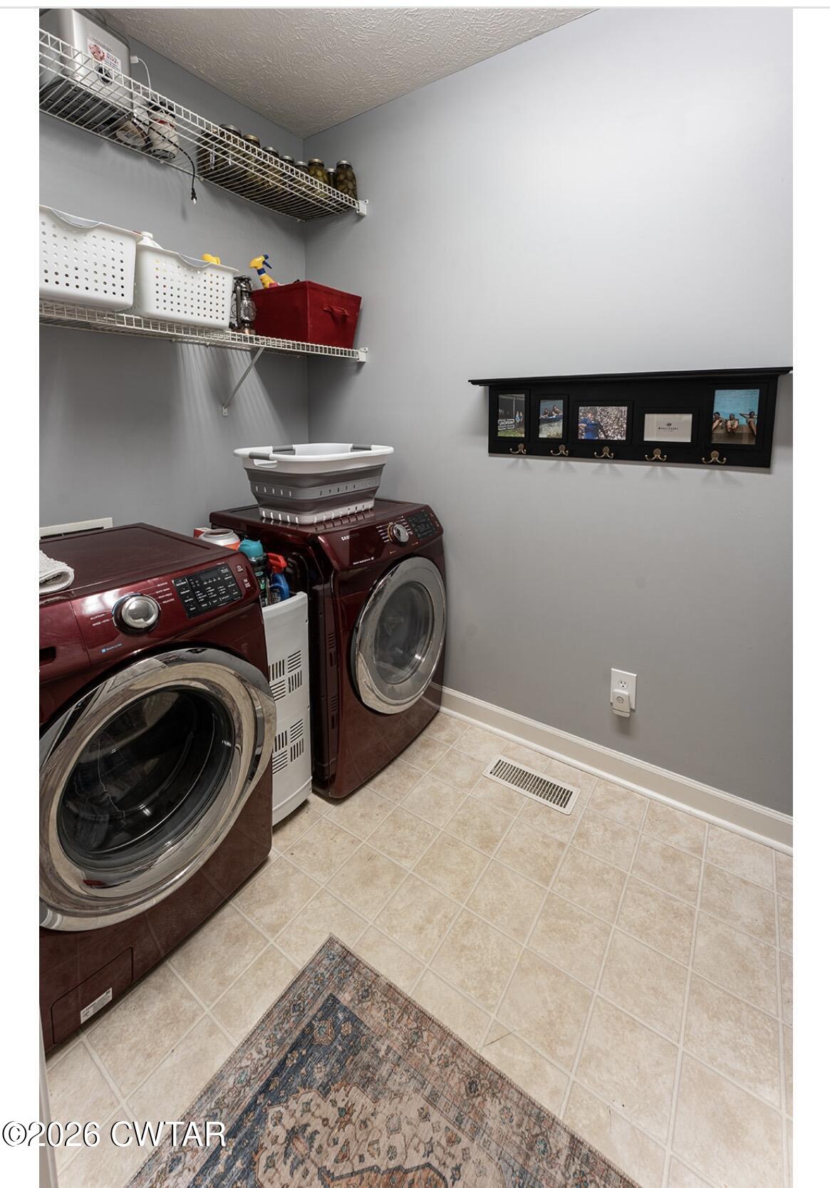 9 Shadow Ridge Drive Jackson, TN 38305 - Photo 22 of 25 a utility room with sink dryer and washer