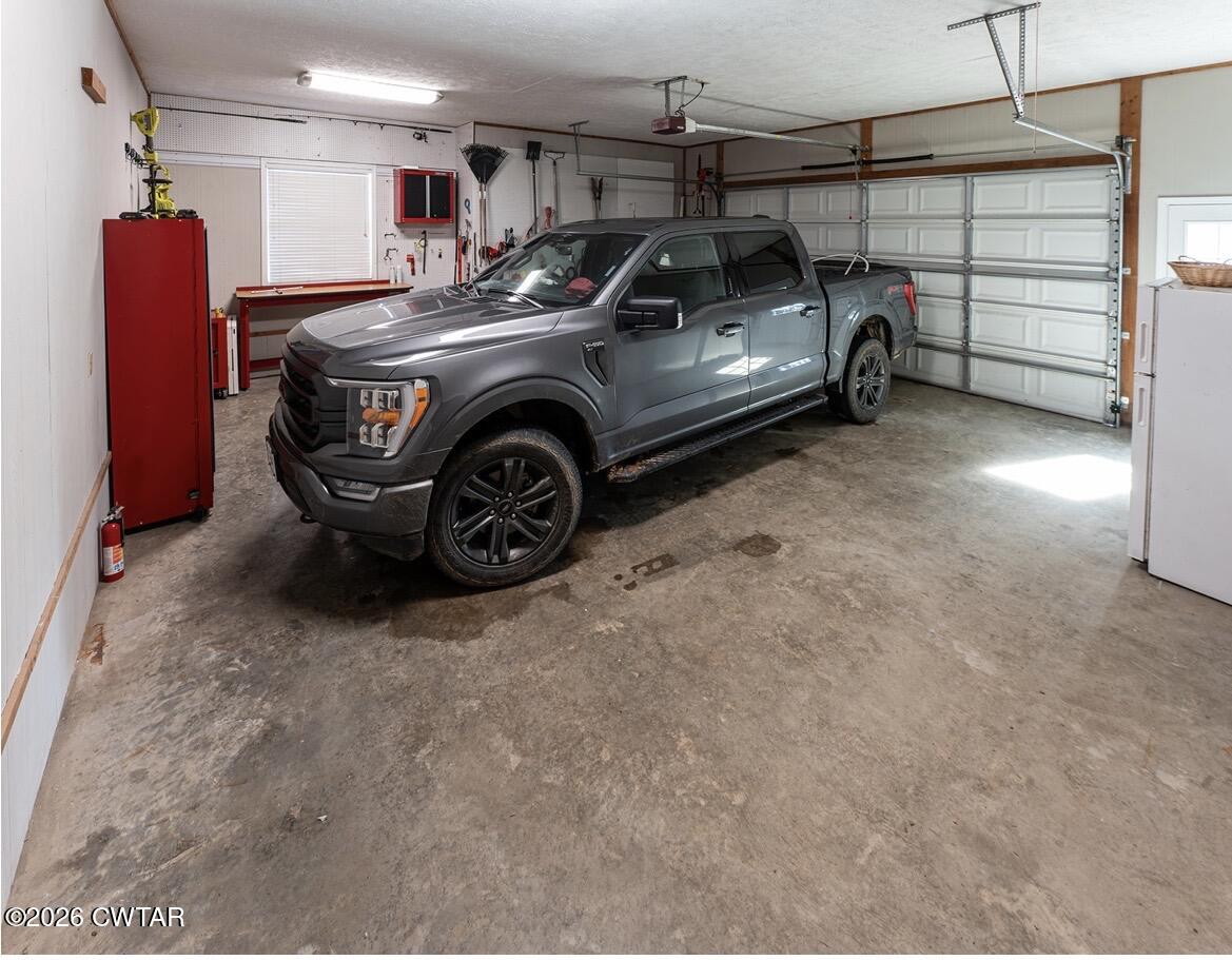 9 Shadow Ridge Drive Jackson, TN 38305 - Photo 23 of 25 a car parked in a garage