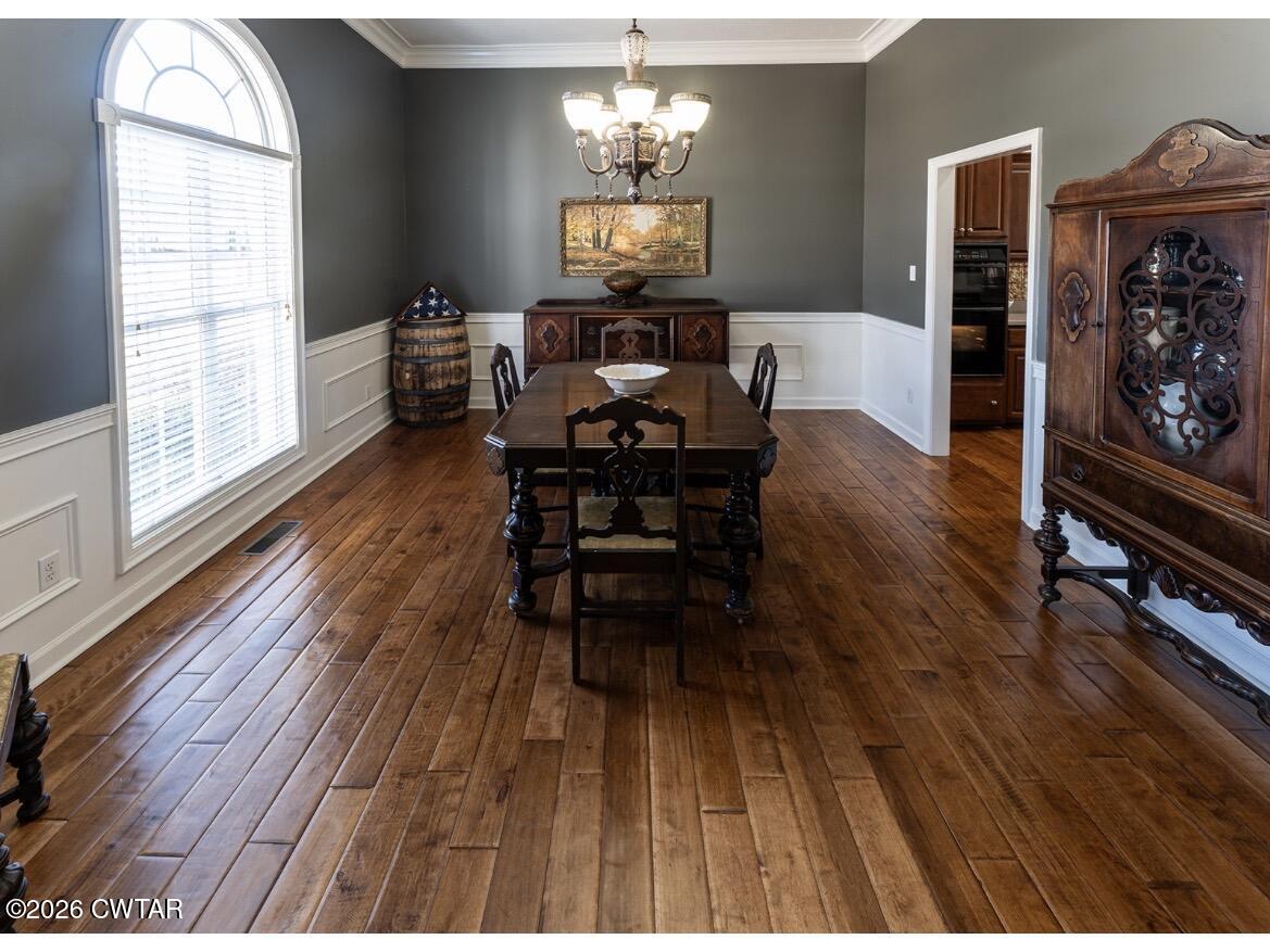 9 Shadow Ridge Drive Jackson, TN 38305 - Photo 5 of 25 a living room with furniture dining table and a wooden floor