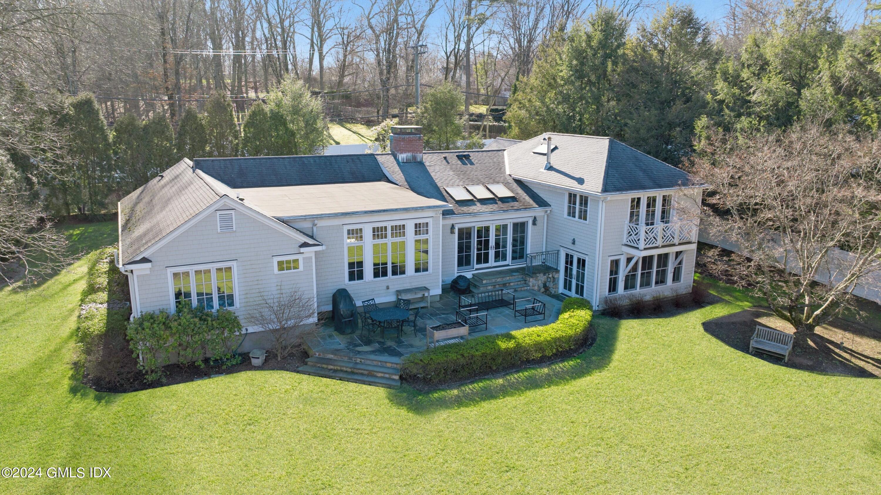 a aerial view of a house with swimming pool and porch