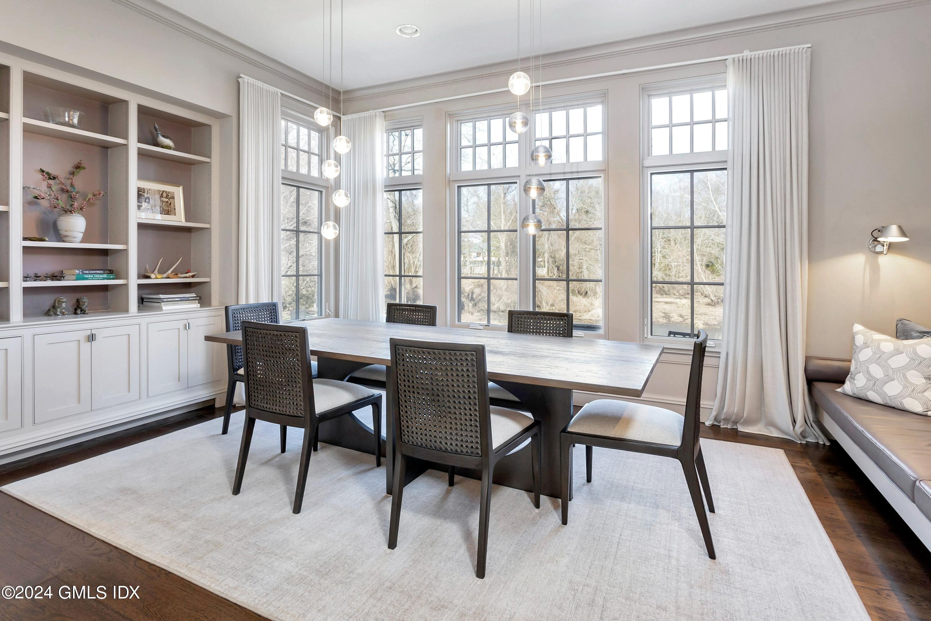 71 Fairfield Road Greenwich, CT 06830 - Photo 11 of 24 a view of a dining room with furniture and a window