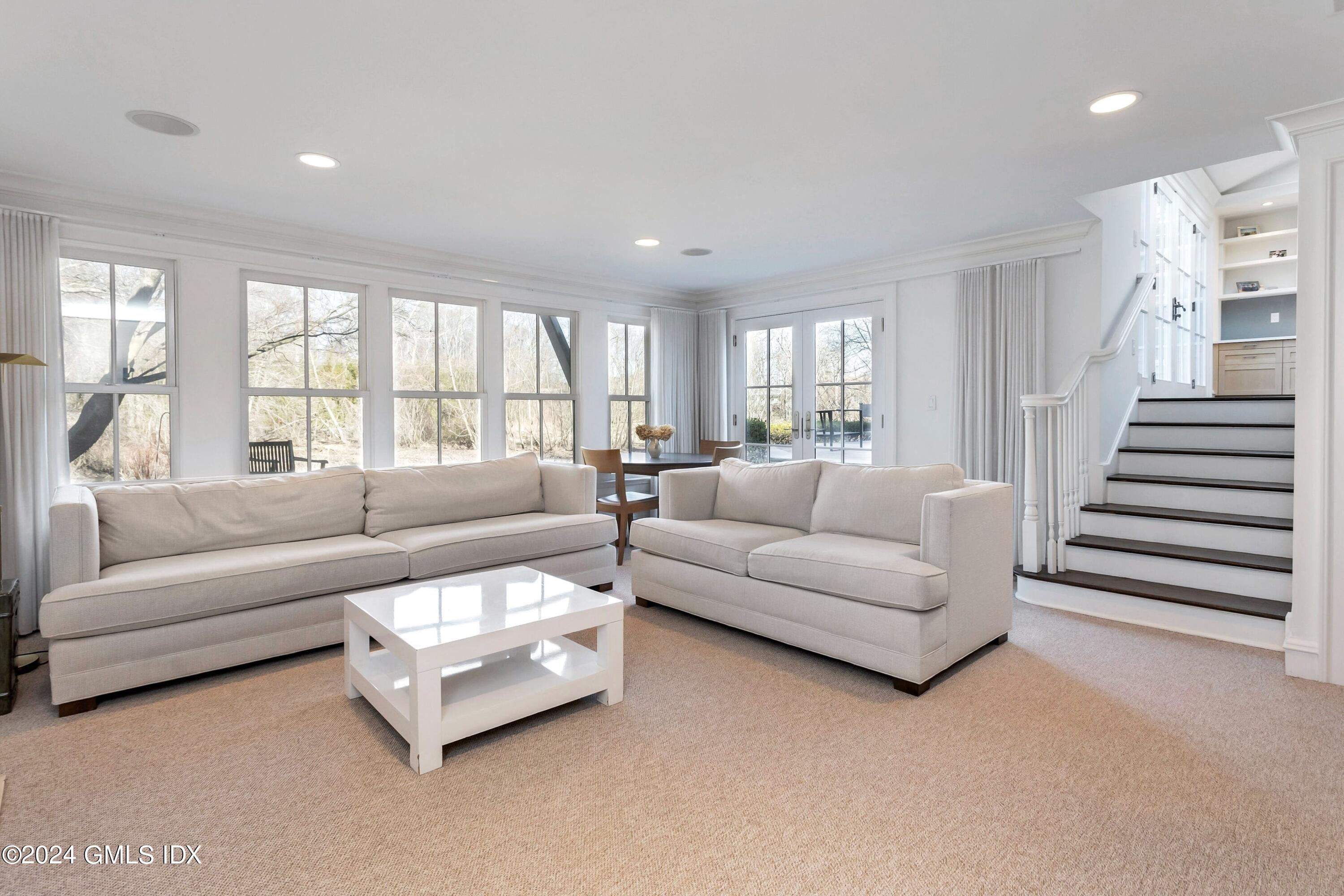 71 Fairfield Road Greenwich, CT 06830 - Photo 13 of 24 a living room with furniture and a large window