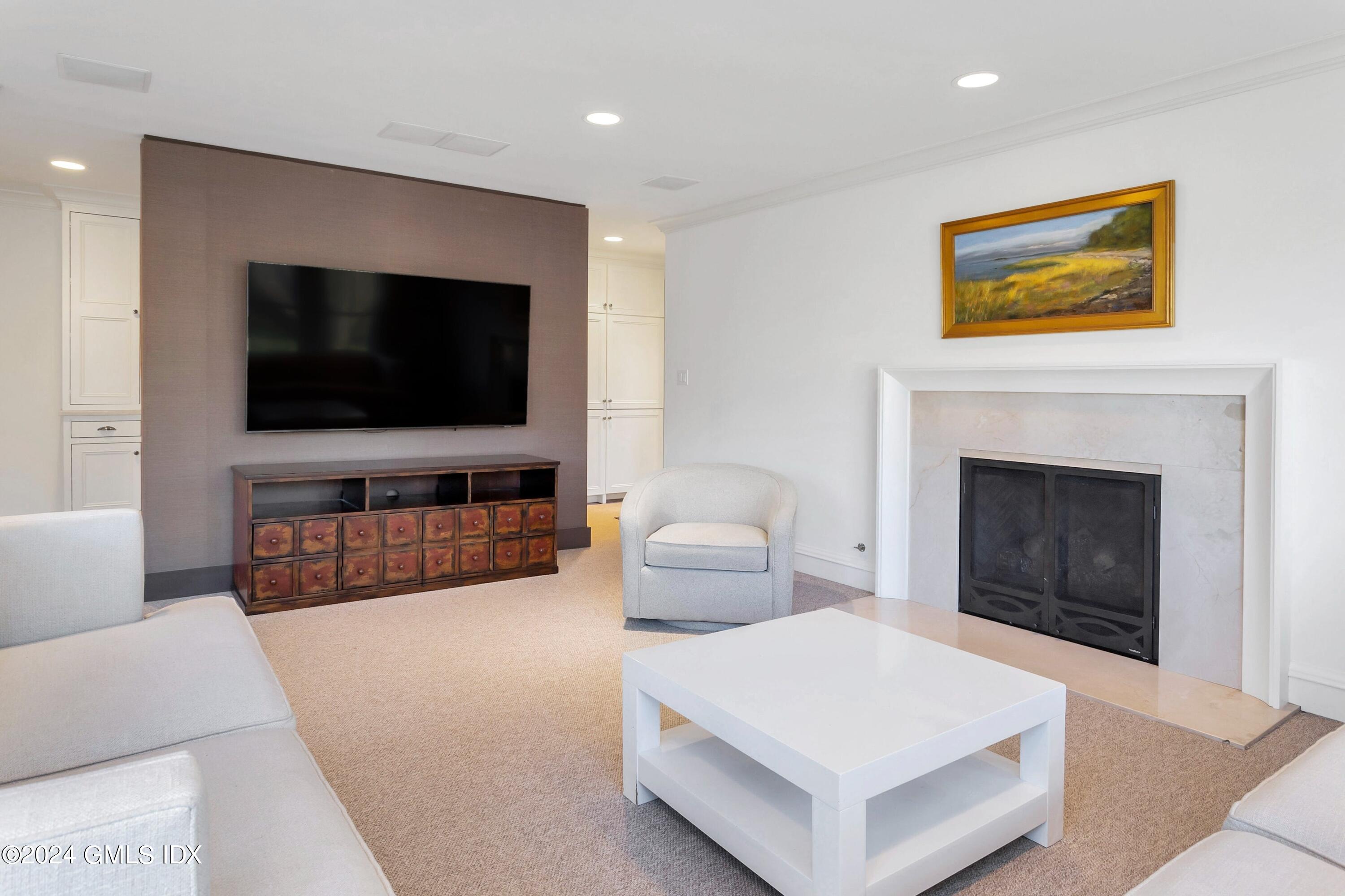 71 Fairfield Road Greenwich, CT 06830 - Photo 14 of 24 a living room with furniture and a flat screen tv