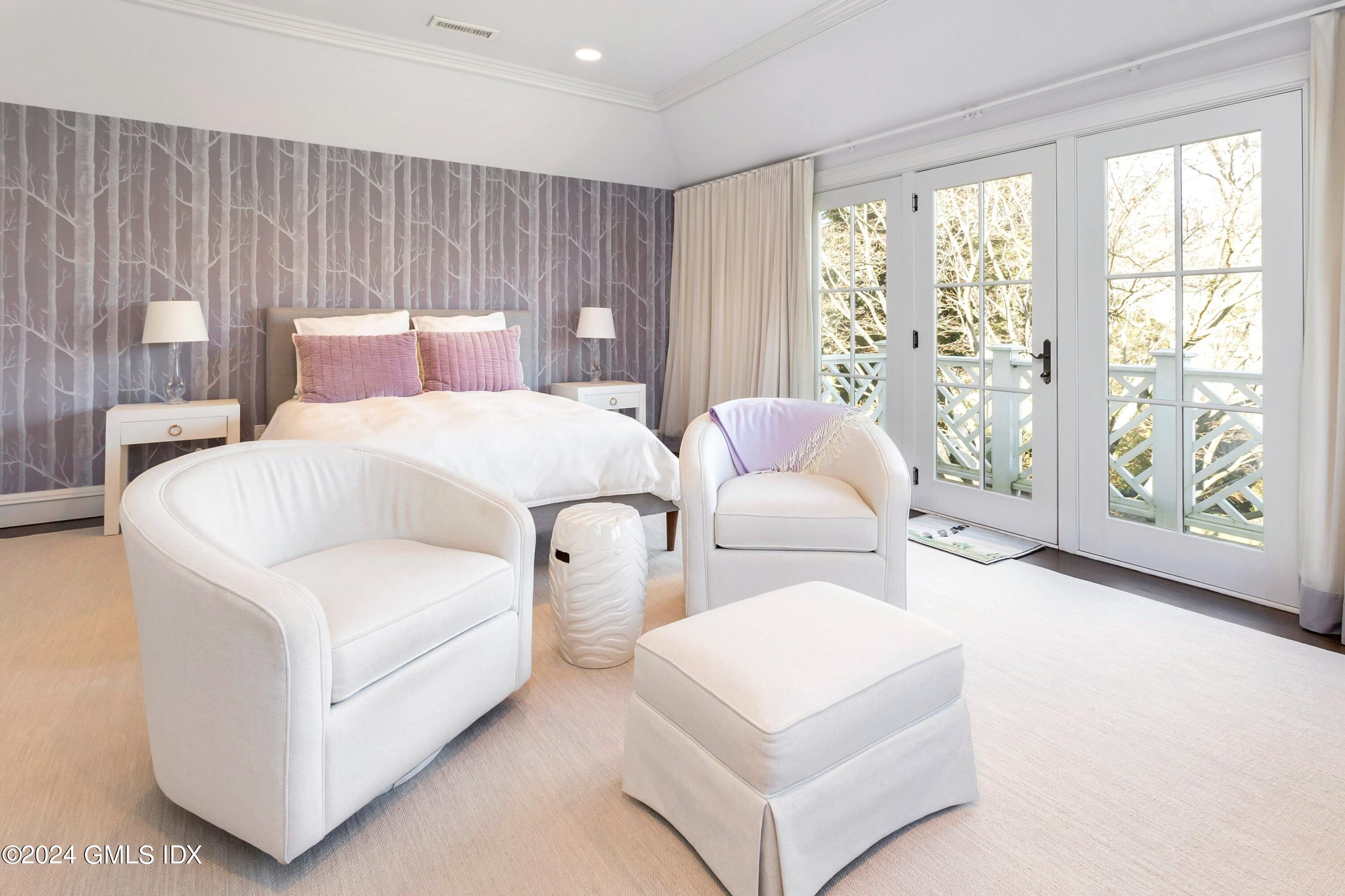 71 Fairfield Road Greenwich, CT 06830 - Photo 16 of 24 a bedroom with bed and large window