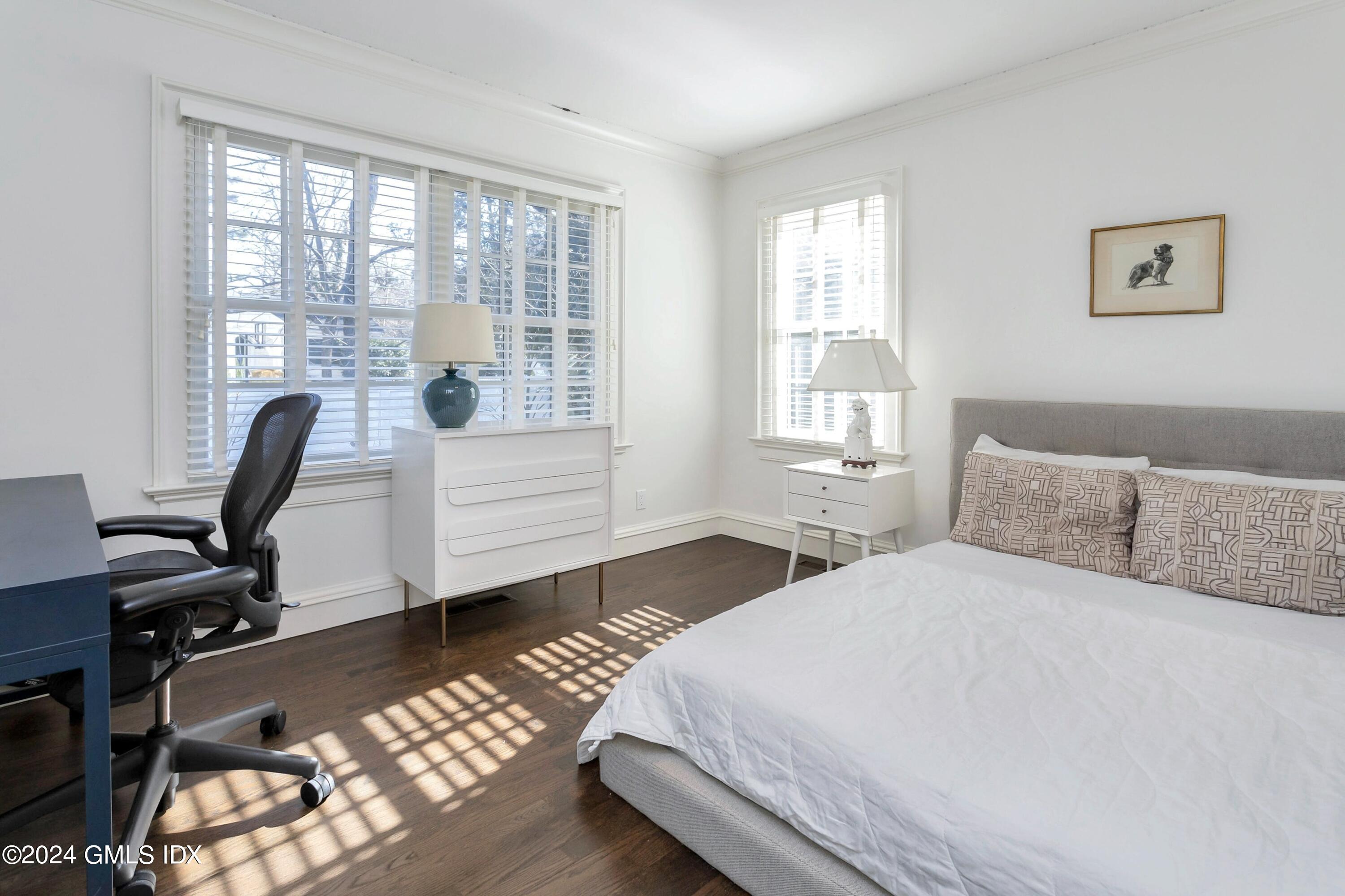 71 Fairfield Road Greenwich, CT 06830 - Photo 19 of 24 a bedroom with a bed and a desk