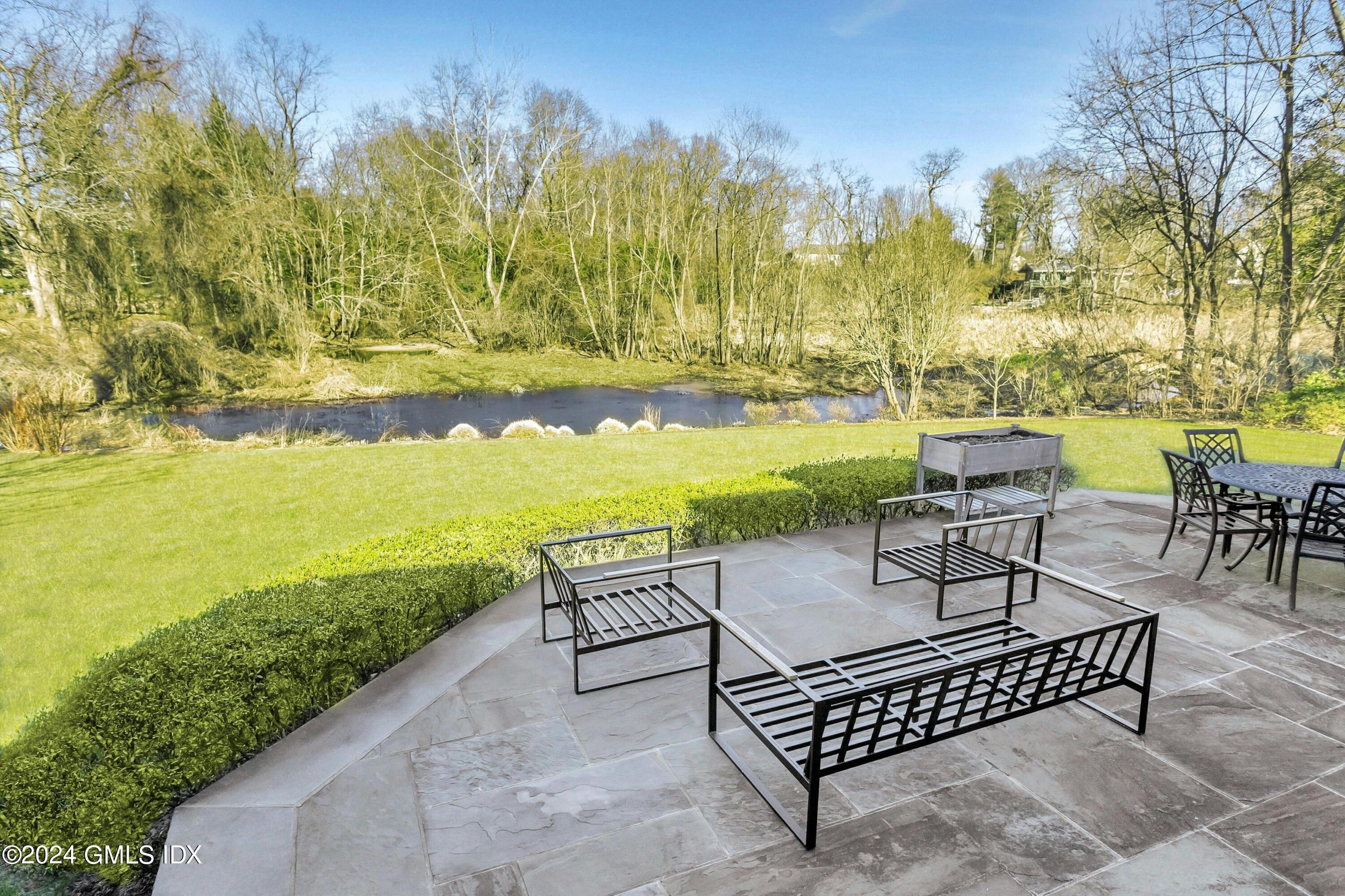 71 Fairfield Road Greenwich, CT 06830 - Photo 22 of 24 a view of a swimming pool with lounge chairs