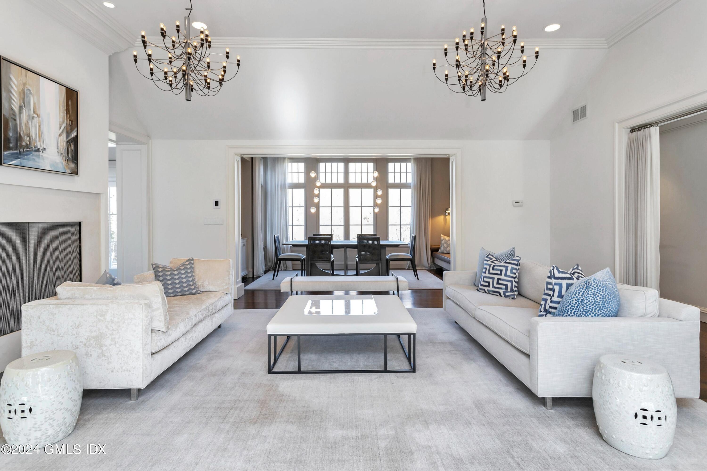 71 Fairfield Road Greenwich, CT 06830 - Photo 6 of 24 a living room with furniture and a chandelier