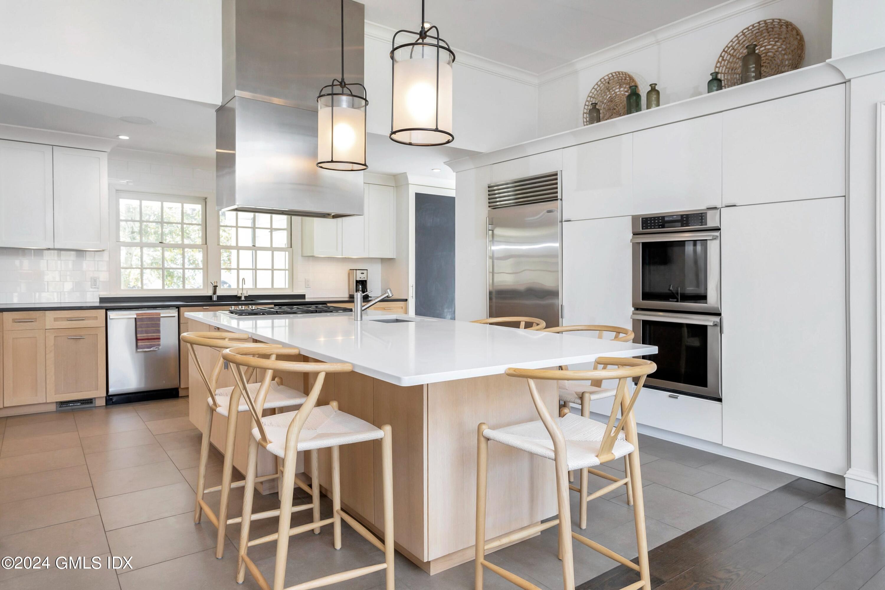 71 Fairfield Road Greenwich, CT 06830 - Photo 8 of 24 a kitchen with stainless steel appliances kitchen island granite countertop a sink and cabinets
