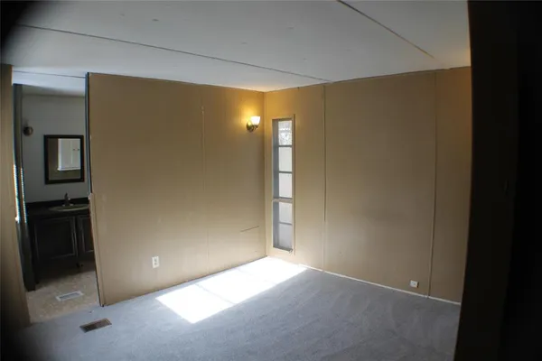 a view of an empty room with a gallery