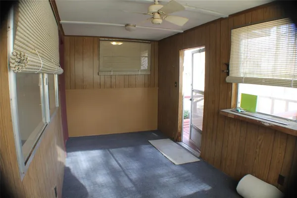 a view of entryway with window and wooden floor