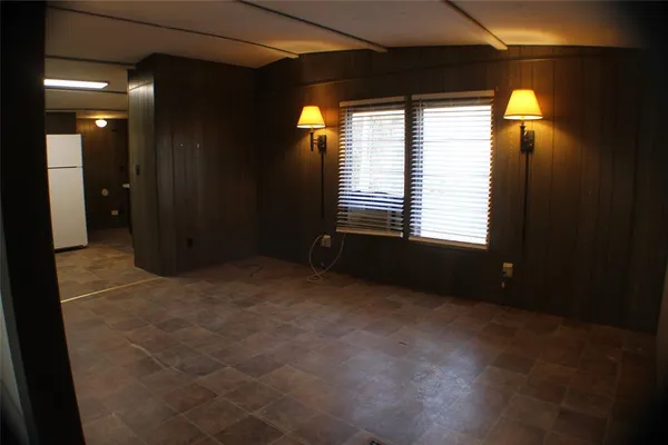 a bathroom with a granite countertop toilet and a shower
