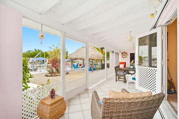 a view of gym equipment with outdoor seating