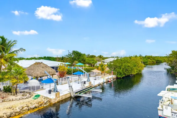 a view of a swimming pool with a table and chairs
