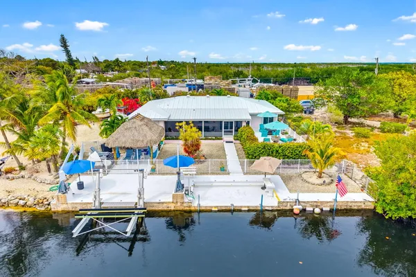 a view of a chairs and table in a patio