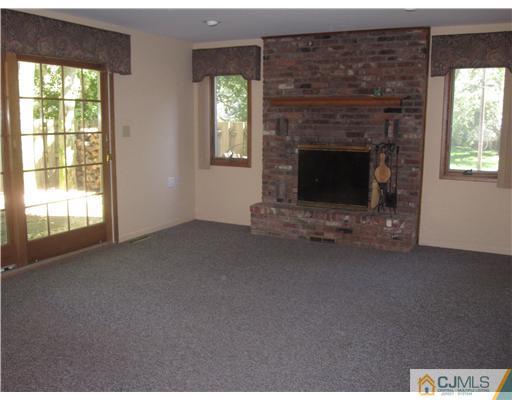 18 Timber Road Edison, NJ 08820 - Photo 5 of 13 a view of empty room with a fireplace