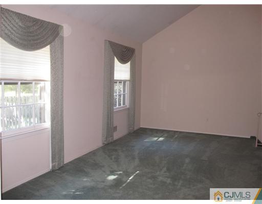 18 Timber Road Edison, NJ 08820 - Photo 7 of 13 an empty room with windows