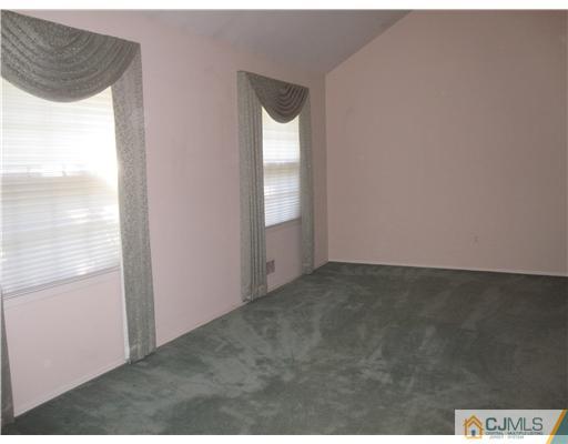 18 Timber Road Edison, NJ 08820 - Photo 8 of 13 a view of an empty room and window