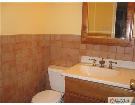 18 Timber Road Edison, NJ 08820 - Photo 9 of 13 a bathroom with a sink and a toilet