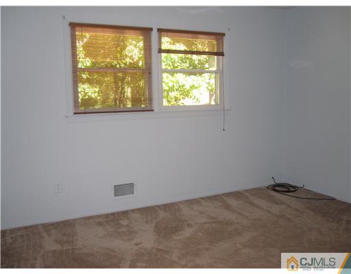 18 Timber Road Edison, NJ 08820 - Photo 10 of 13 an empty room with a window