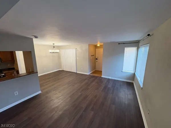 a view of a livingroom with wooden floor