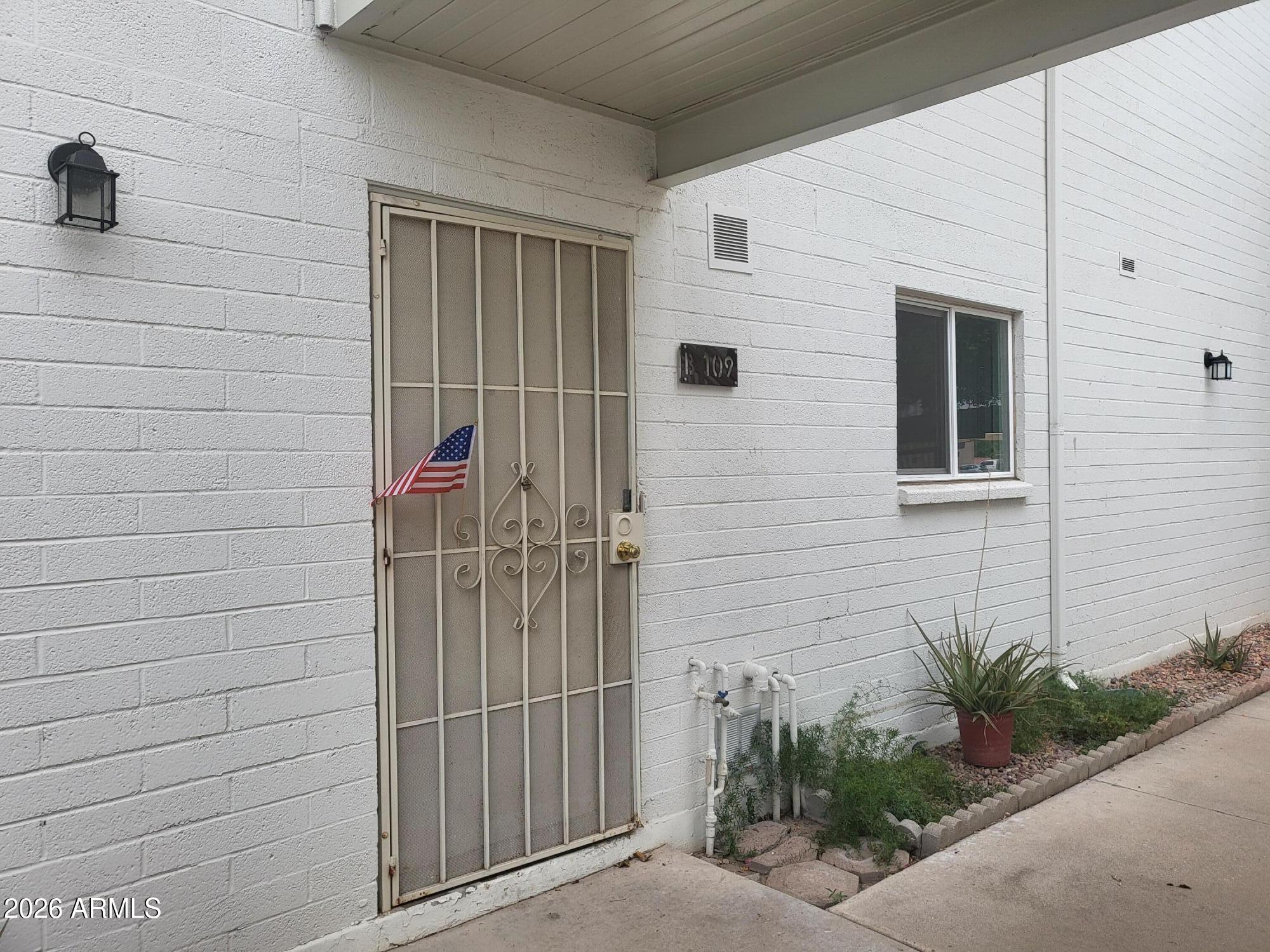 815 North Hayden Road, Unit B109 Scottsdale, AZ 85257 - Photo 17 of 25 a view of a door and a window