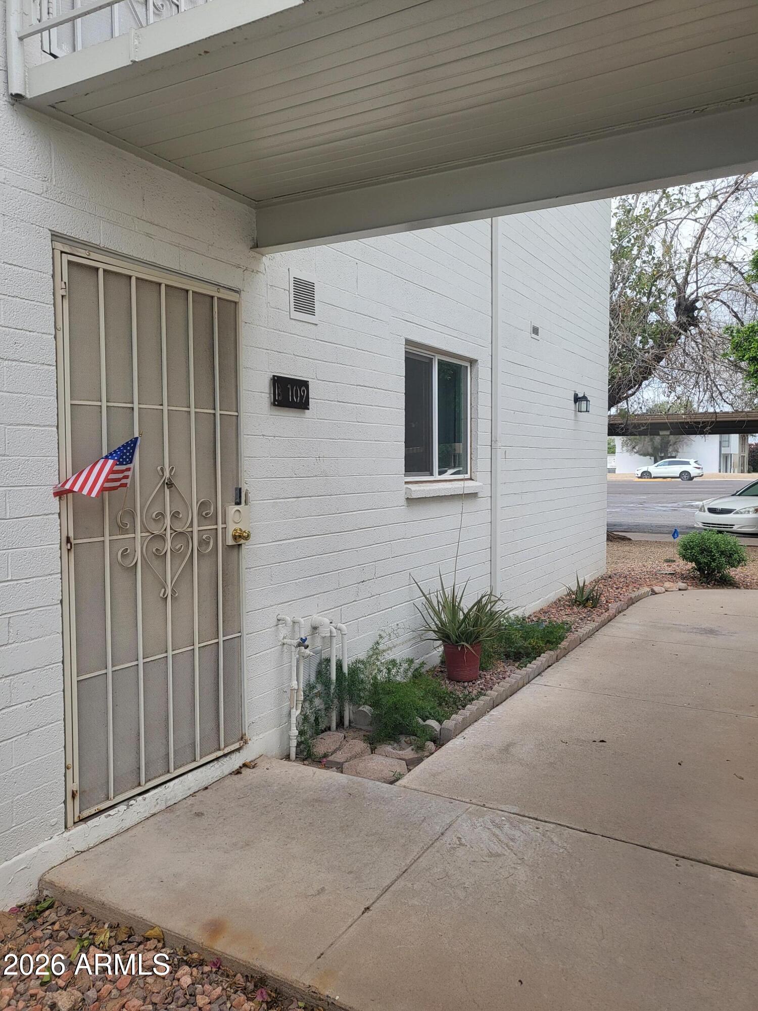 815 North Hayden Road, Unit B109 Scottsdale, AZ 85257 - Photo 18 of 25 a front view of a house with a yard