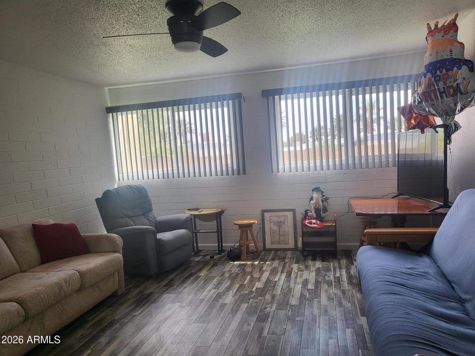 815 North Hayden Road, Unit B109 Scottsdale, AZ 85257 - Photo 2 of 25 a living room with furniture and a window