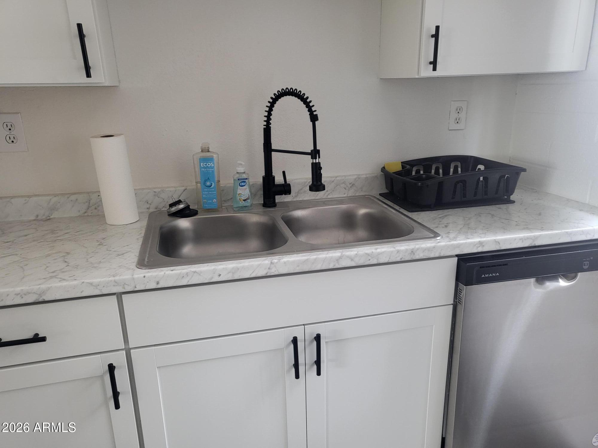 815 North Hayden Road, Unit B109 Scottsdale, AZ 85257 - Photo 5 of 25 a close view of sink and tap