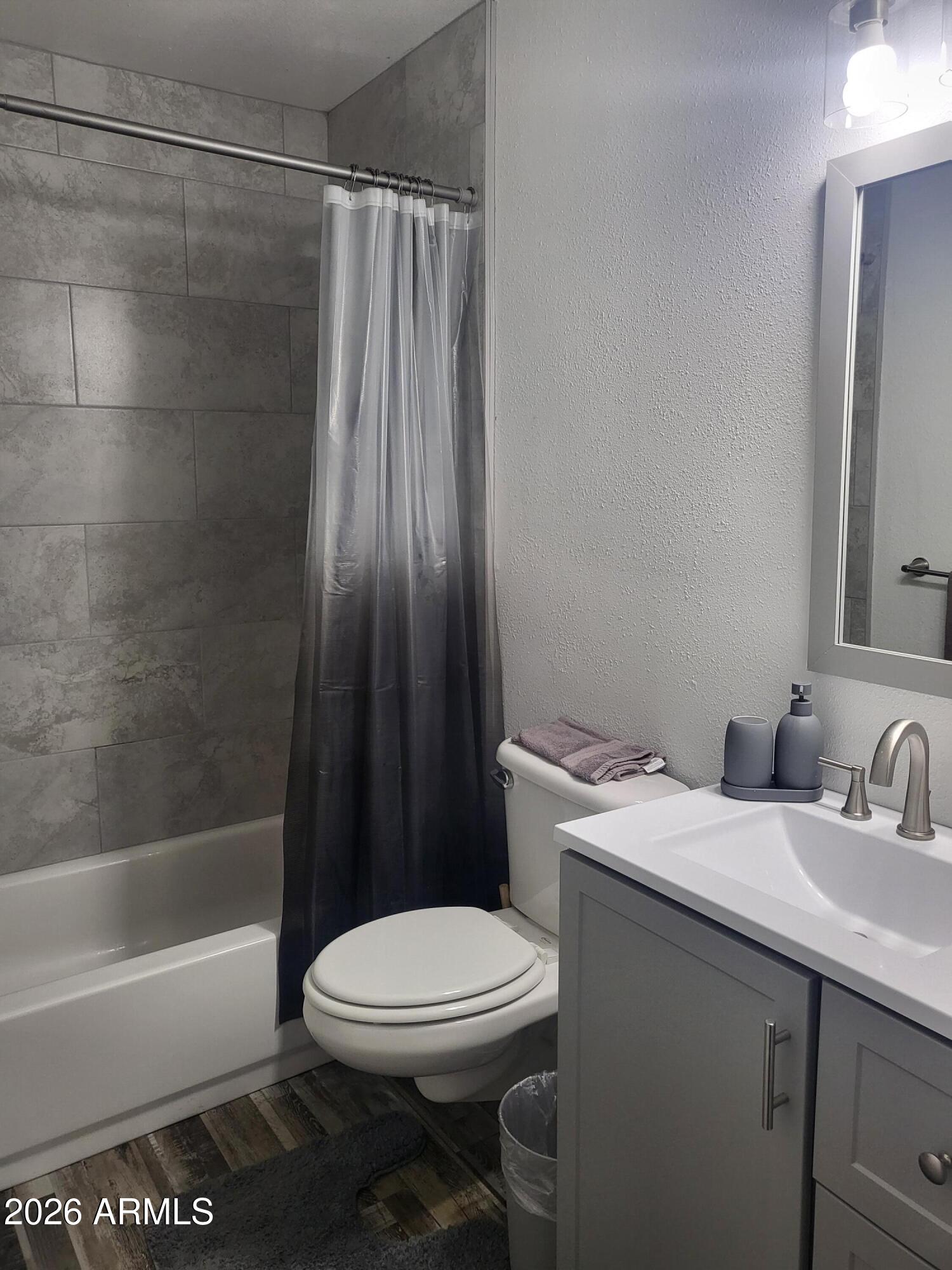 815 North Hayden Road, Unit B109 Scottsdale, AZ 85257 - Photo 7 of 25 a bathroom with a sink a toilet and shower