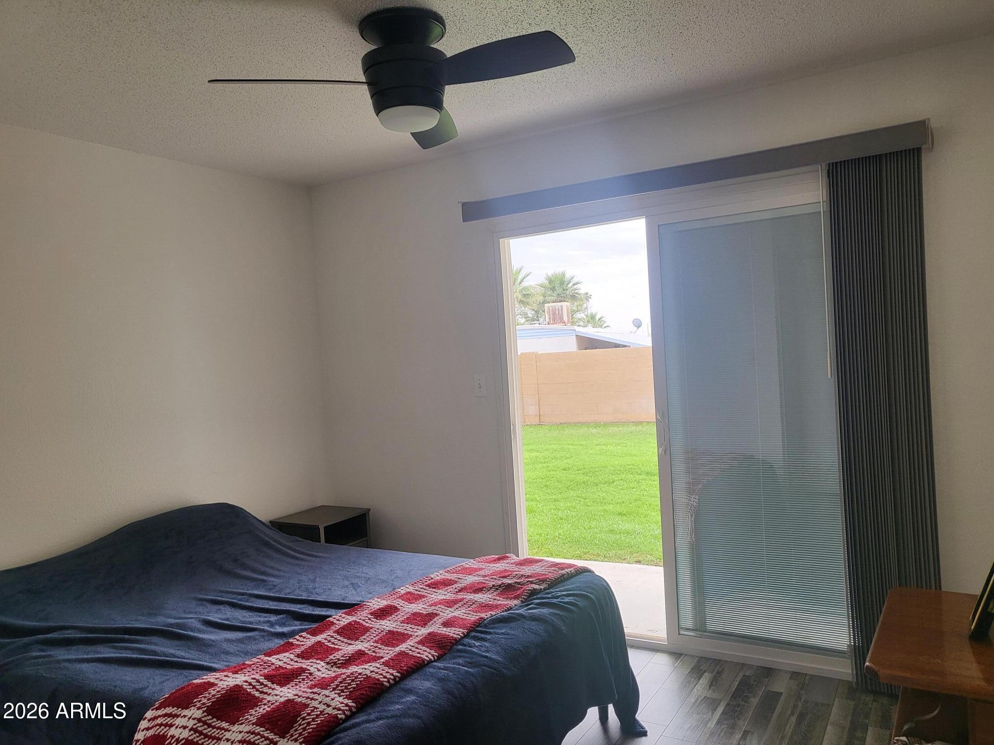 815 North Hayden Road, Unit B109 Scottsdale, AZ 85257 - Photo 10 of 25 a bedroom with a bed and a window
