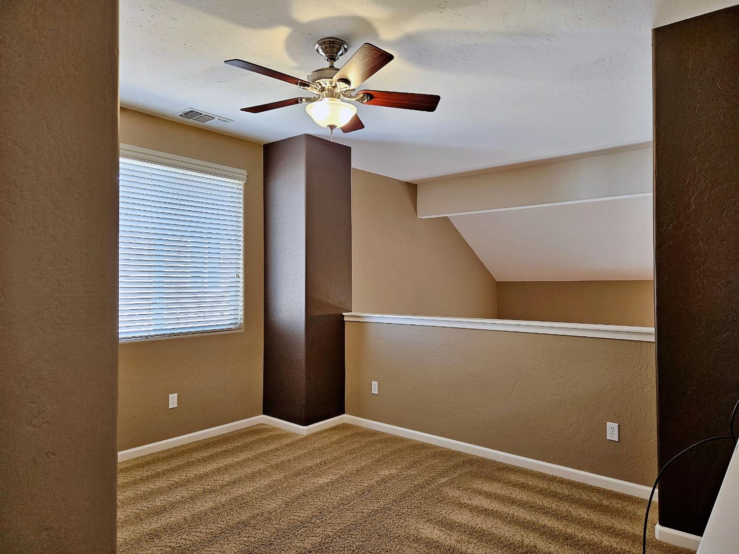 828 Tureaud Lane Clovis, CA 93619 - Photo 16 of 24 a view of an empty room with a window