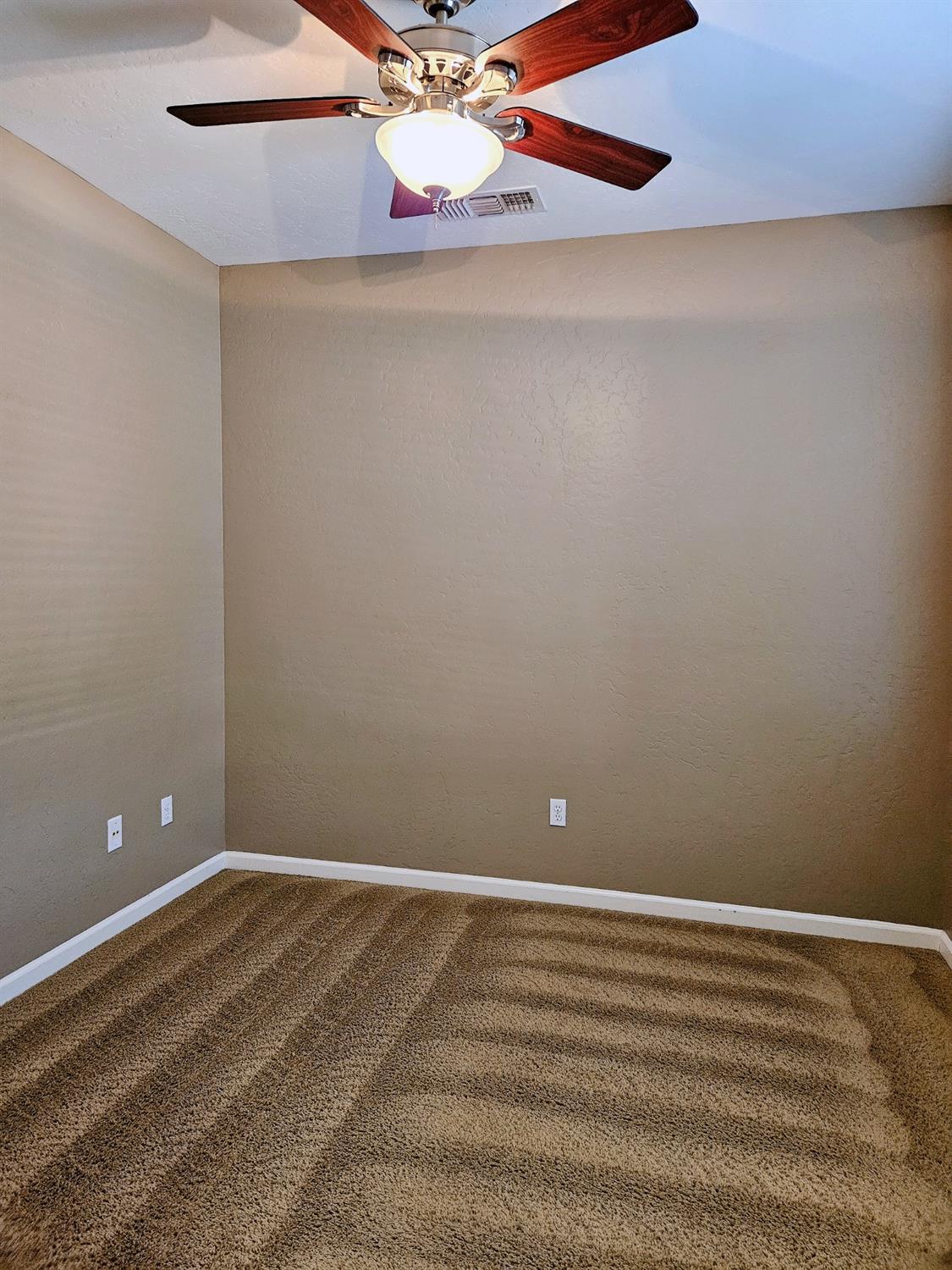 828 Tureaud Lane Clovis, CA 93619 - Photo 18 of 24 a view of a room with wooden floor