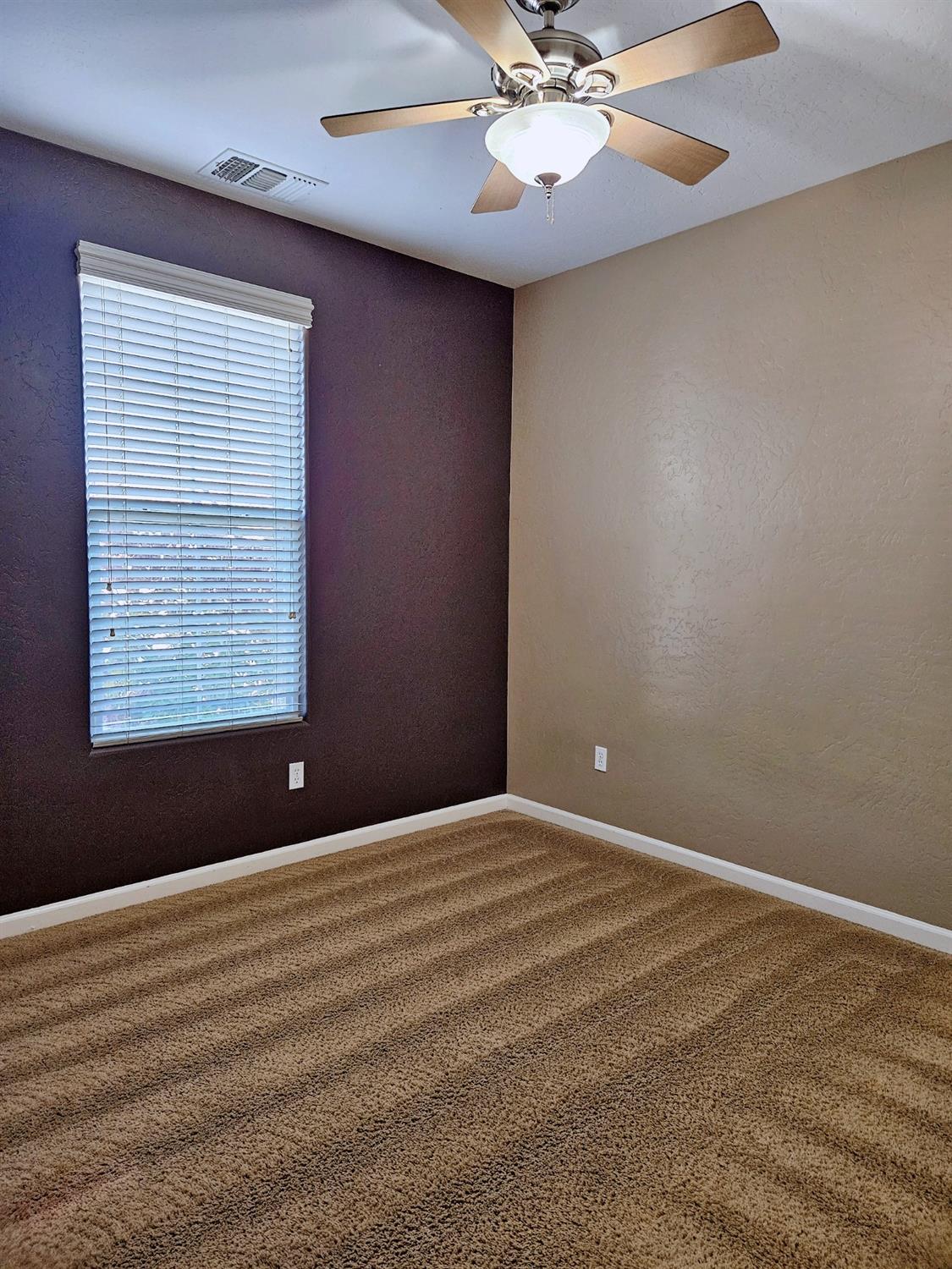 828 Tureaud Lane Clovis, CA 93619 - Photo 21 of 24 a view of an empty room with a window