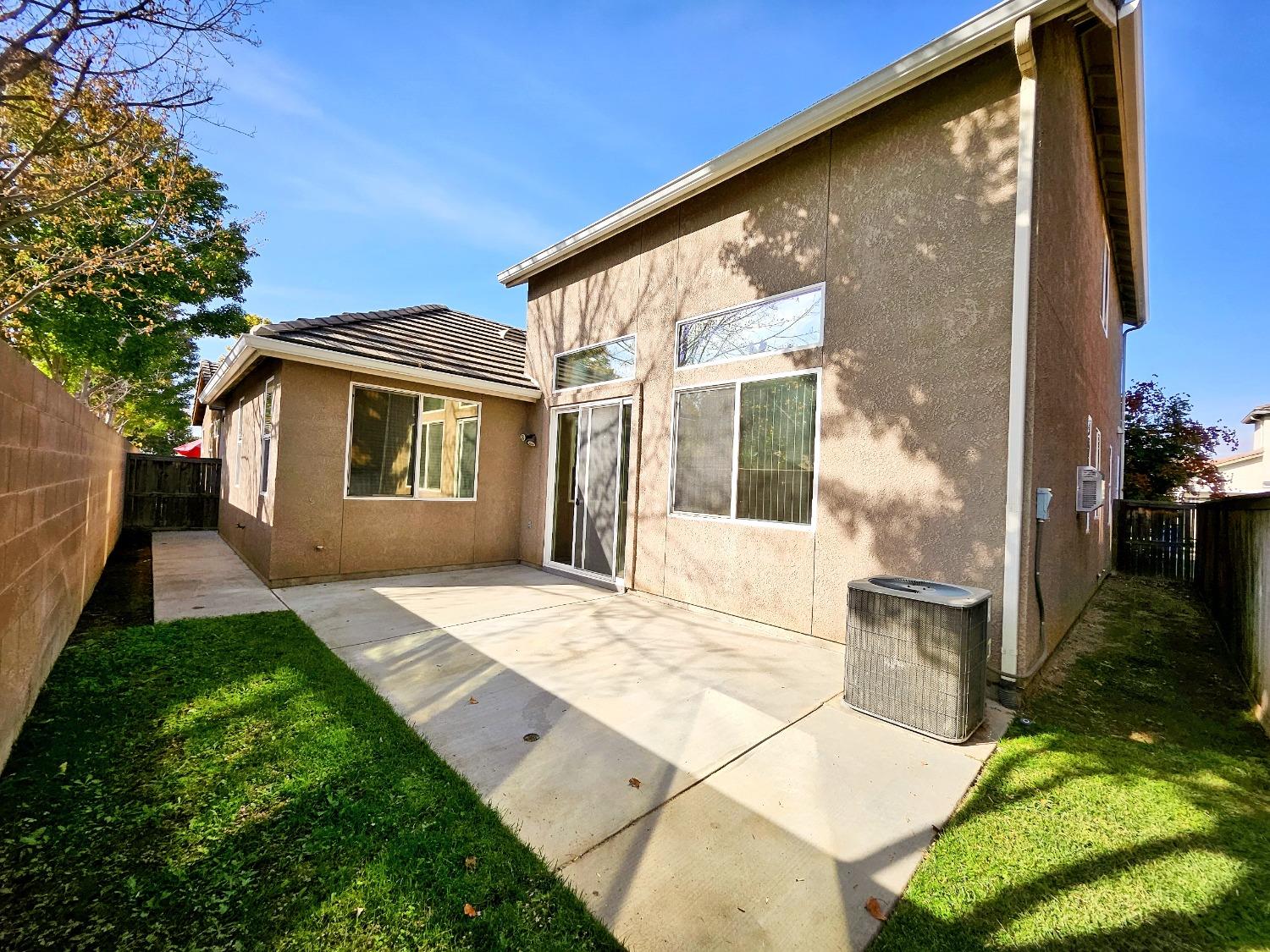 828 Tureaud Lane Clovis, CA 93619 - Photo 23 of 24 a backyard of a house with seating space