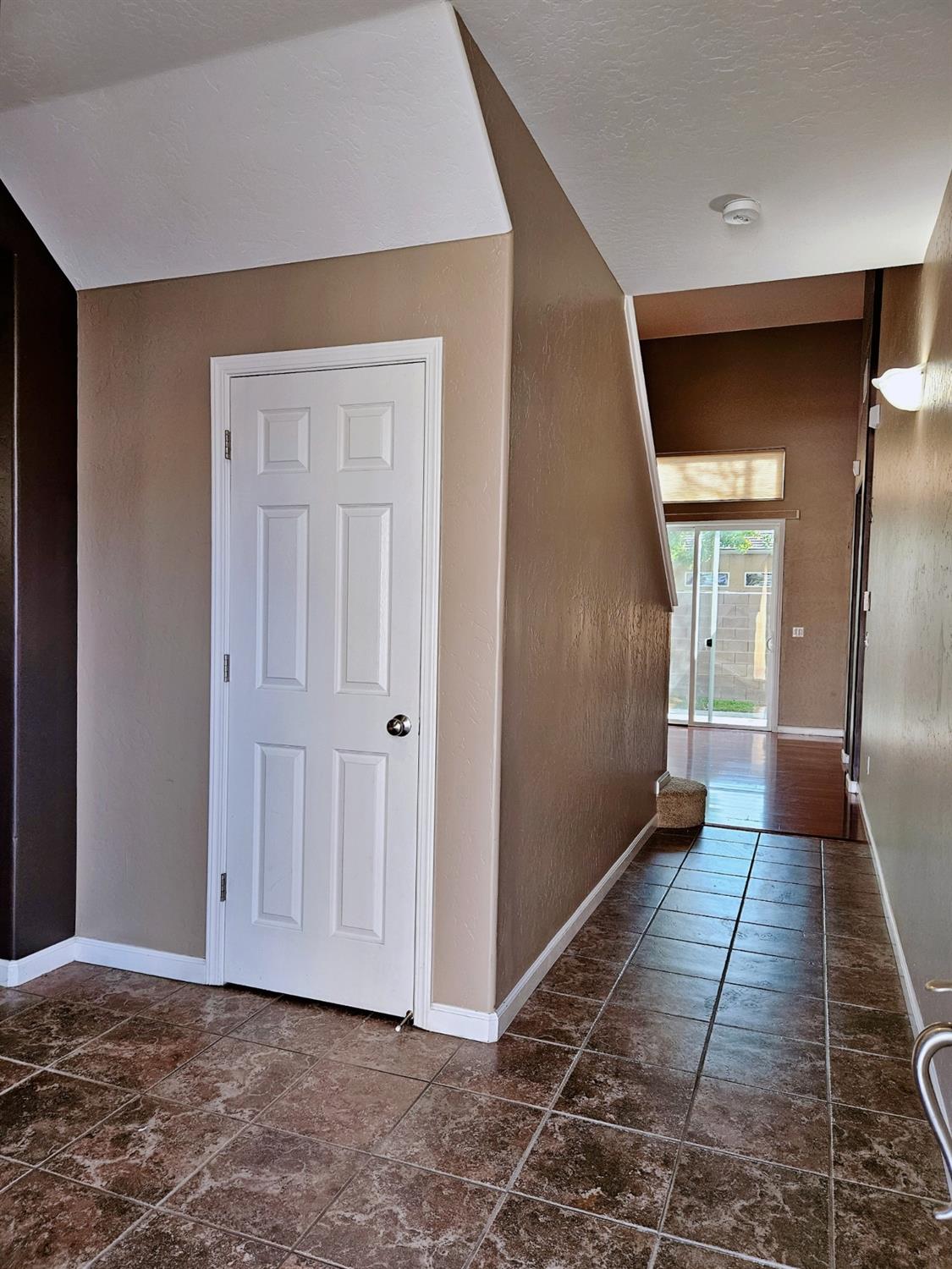 828 Tureaud Lane Clovis, CA 93619 - Photo 3 of 24 a view of hallway with wooden floor