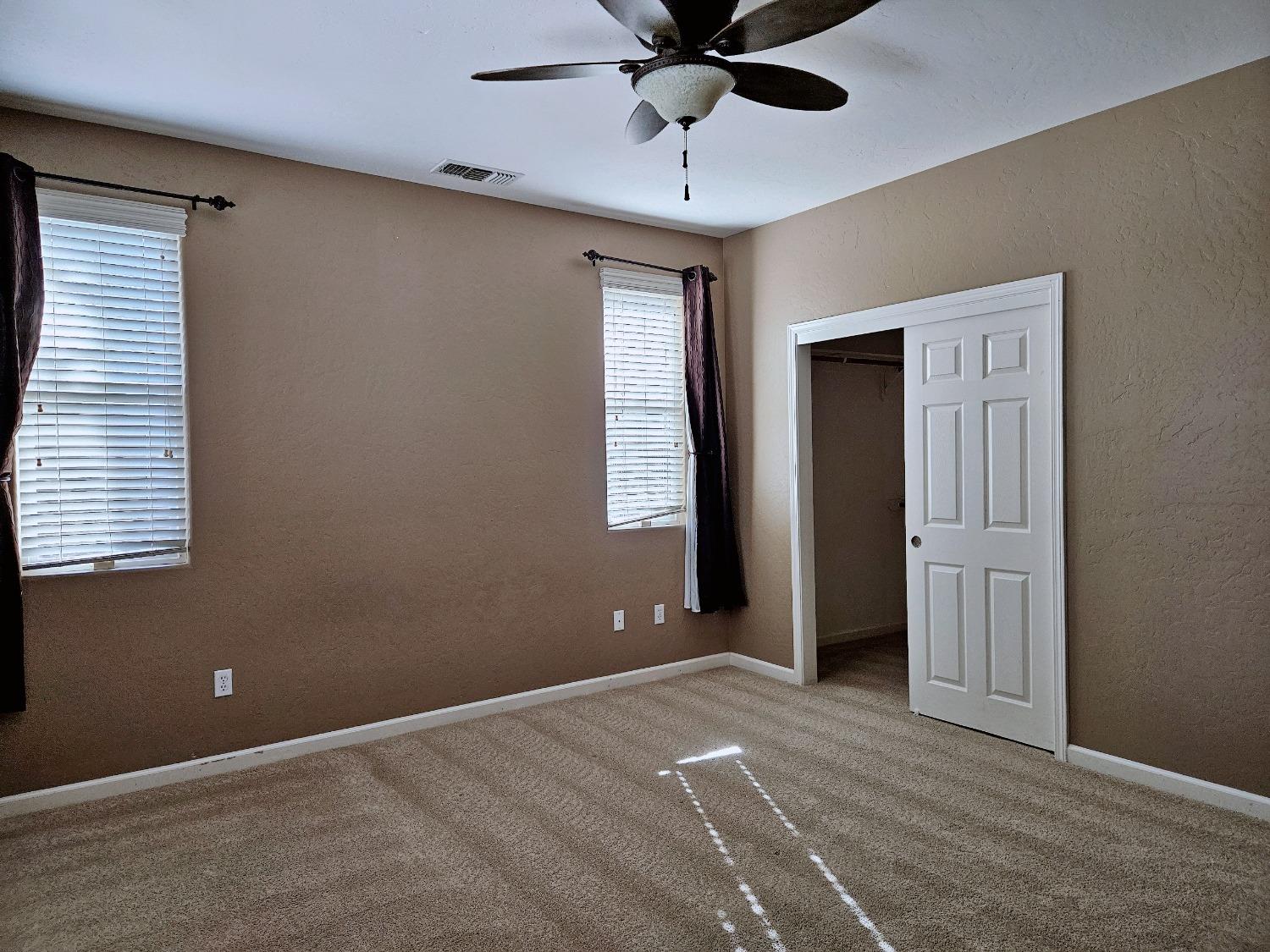 828 Tureaud Lane Clovis, CA 93619 - Photo 6 of 24 a view of an empty room with a window