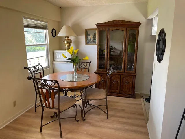 a living room with furniture and a lamp