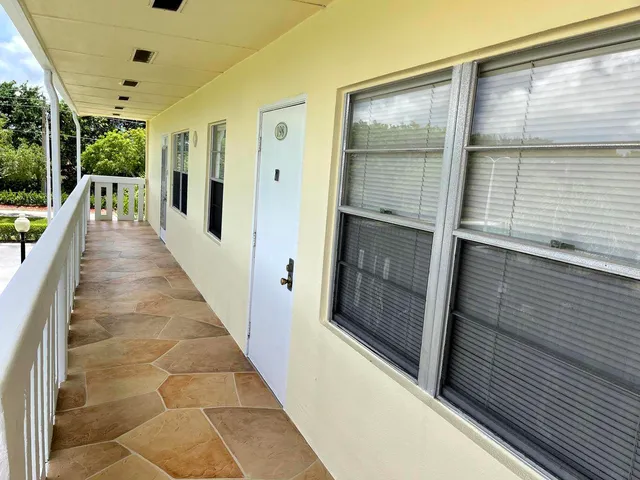 a bedroom with a bed and a lamp