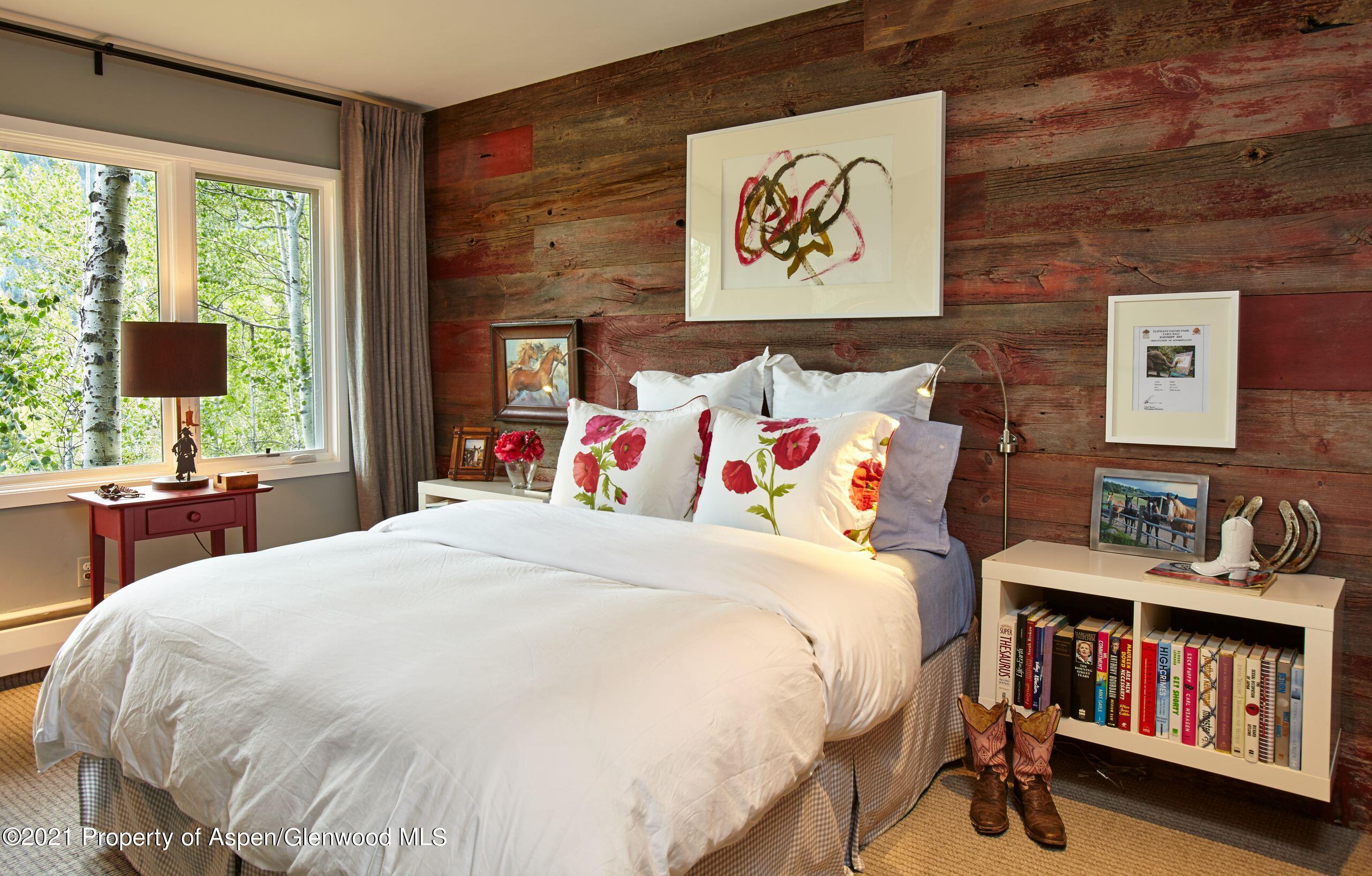 122 Eastwood Road Aspen, CO 81611 - Photo 12 of 22 a bedroom with a bed and dresser