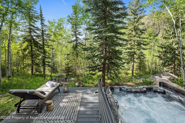 a view of a yard with chairs