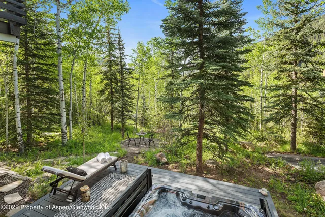 a view of yard from deck having patio