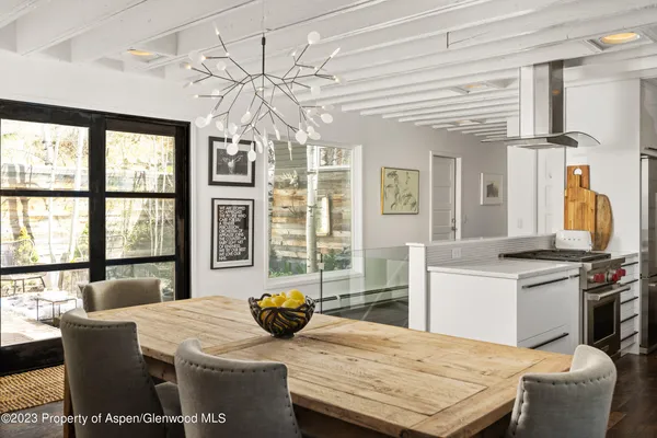a kitchen with stainless steel appliances granite countertop a stove and white cabinets