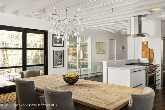 a kitchen with stainless steel appliances granite countertop a stove and white cabinets