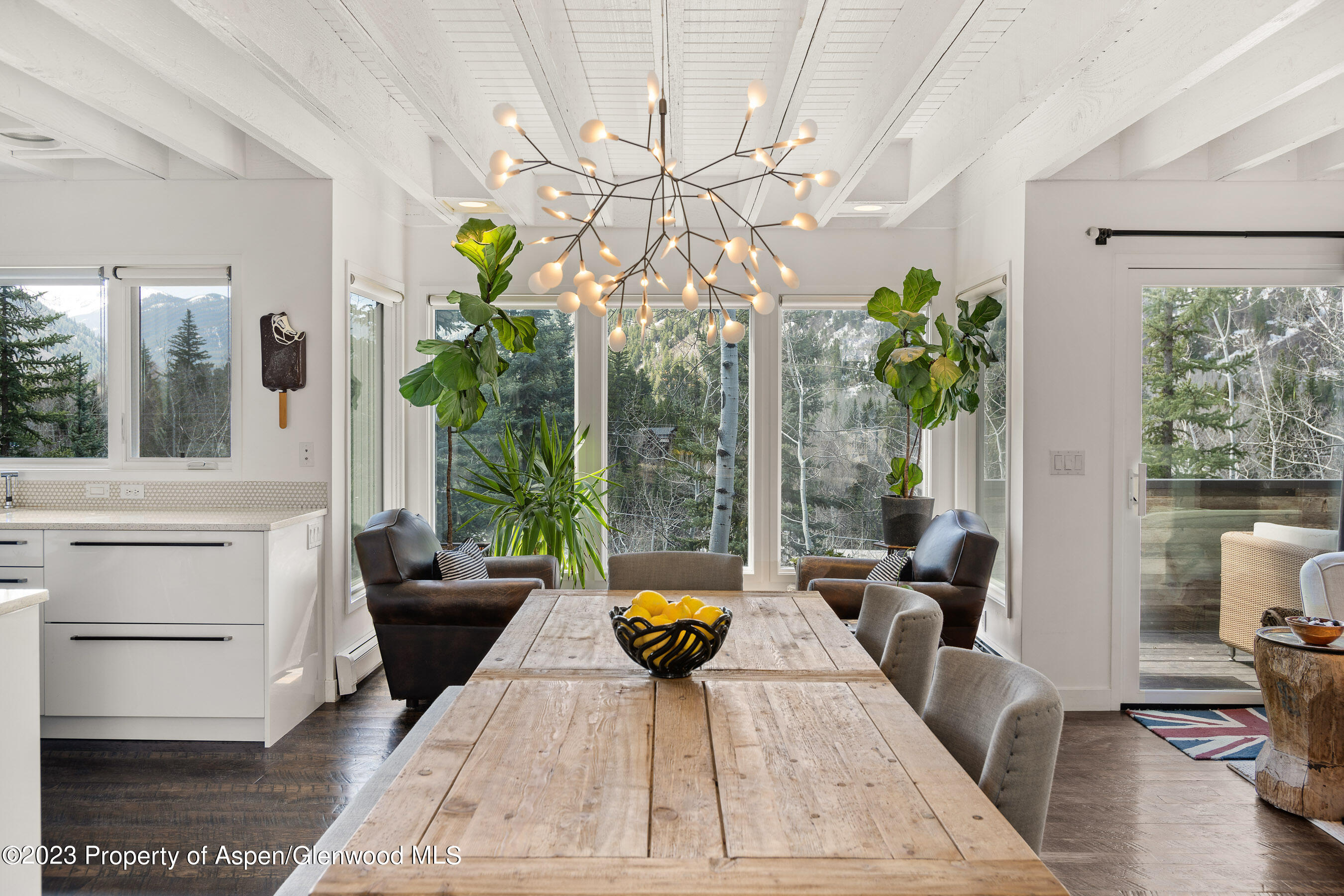 122 Eastwood Road Aspen, CO 81611 - Photo 4 of 22 a living room with furniture and a chandelier